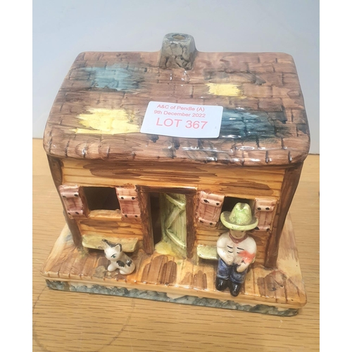 367 - Ceramic house and a figurine on wooden plinth (2)