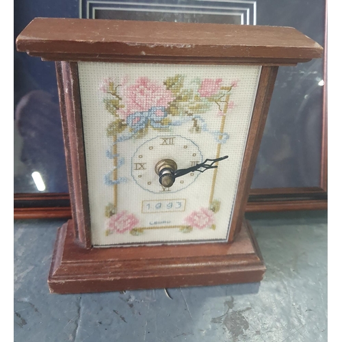 1020 - Wooden desk top clock with embroidered frontage together with framed embroideries (Qty)