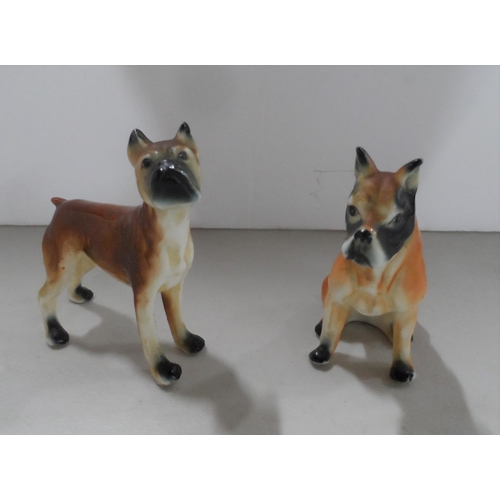 1070 - Two mid 20thC unmarked small Boxer dog figures (2)