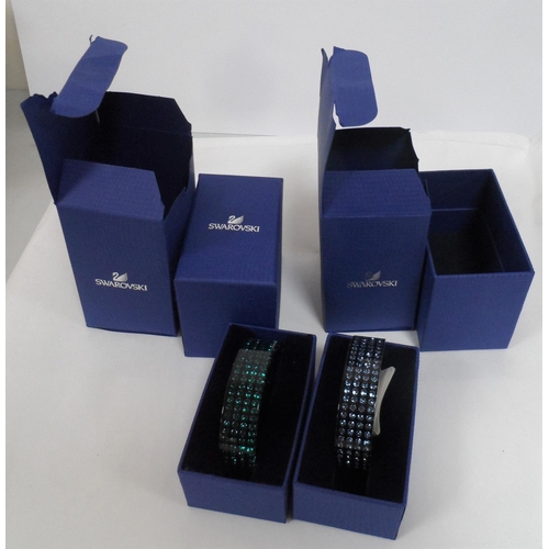 32 - Two, boxed, as new, Swarovski bangles (2)