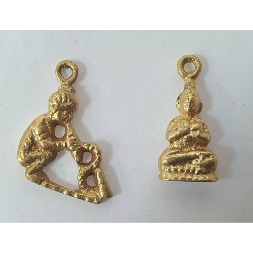 35 - Four unmarked Indian gold charms together with a pair of unmarked gold coloured earrings (6 grams) t... 