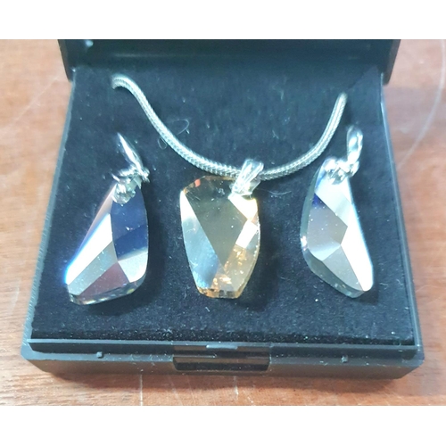 42 - 925 silver necklace with crystal pendant together with associated crystal earrings