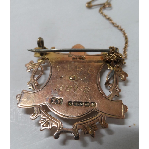 58 - Old 9ct gold fob/medal with dragon decoration, converted to a brooch,

5.2 grams