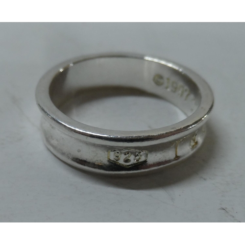 59 - Tiffany and Co, silver ring
Size Q