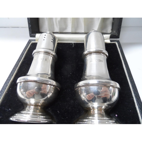 63 - Cased pair of Birmingham silver salt cellars,

66 grams