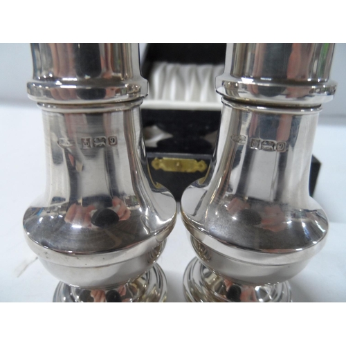 63 - Cased pair of Birmingham silver salt cellars,

66 grams