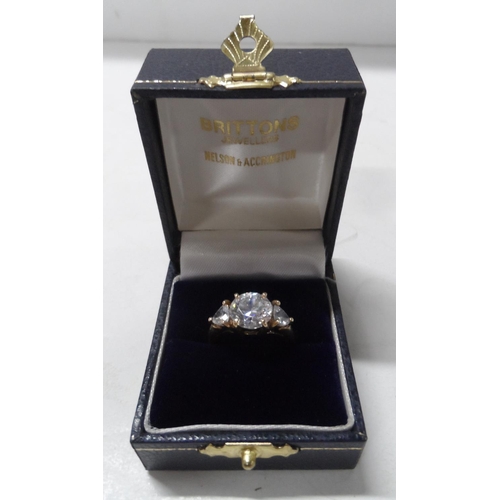 64 - 9ct yellow gold ring with 3 glass stones,

3.2 grams gross