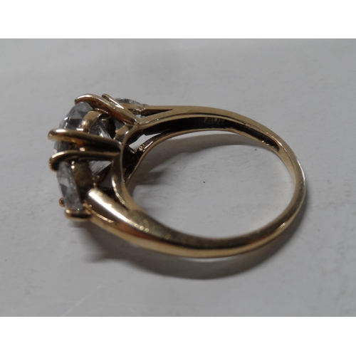 64 - 9ct yellow gold ring with 3 glass stones,

3.2 grams gross