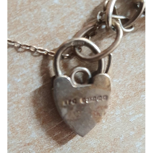 78 - 9 ct gold charm bracelet with 6 charms,

11.6 grams