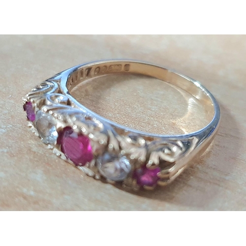 97 - 9ct yellow gold and pink Sapphire ring interspersed between 2 clear stones, possibly CZ,

3.5 grams ... 
