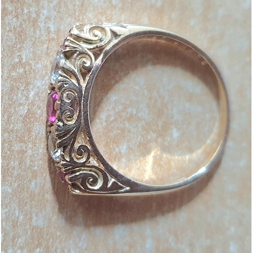 97 - 9ct yellow gold and pink Sapphire ring interspersed between 2 clear stones, possibly CZ,

3.5 grams ... 