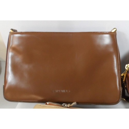 142 - Four designer handbags, mostly unused, as new, including two by Valentino (4)