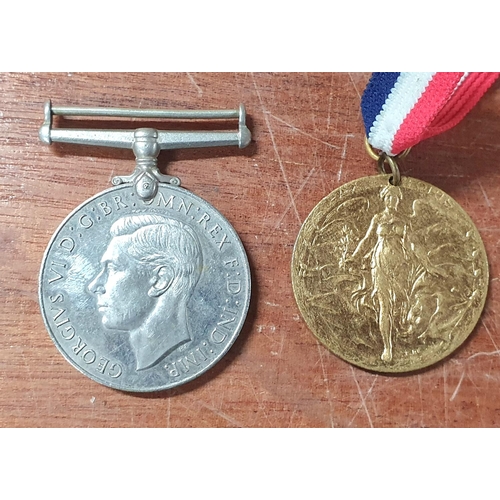 107 - Birmingham 1919 peace medal together with a 1939-1945 defence medal (2)