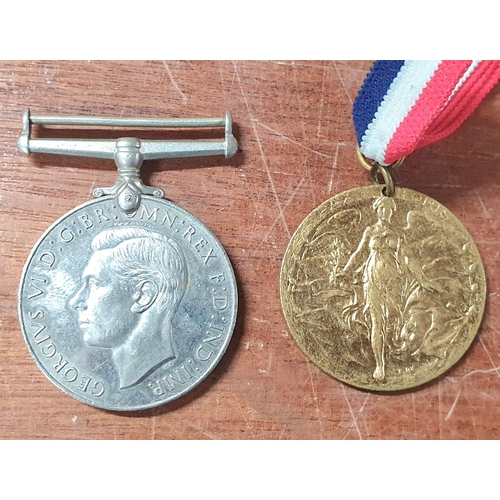 107 - Birmingham 1919 peace medal together with a 1939-1945 defence medal (2)