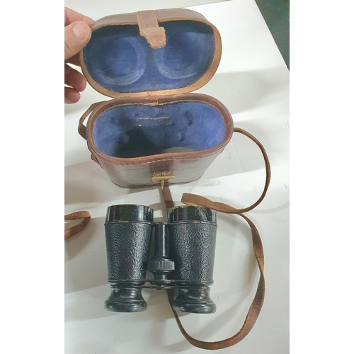 86 - Two pairs of military regulation binoculars together with a pair of antique opera glasses (3)