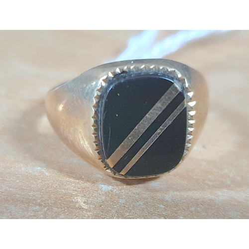 20 - 9ct yellow gold signet ring with black stone,

3.1 grams            size R