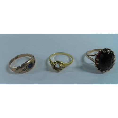 28 - 9ct yellow gold ring with hug oval cut Garnet together with 2 other 9ct gold & diamond rings, both a... 