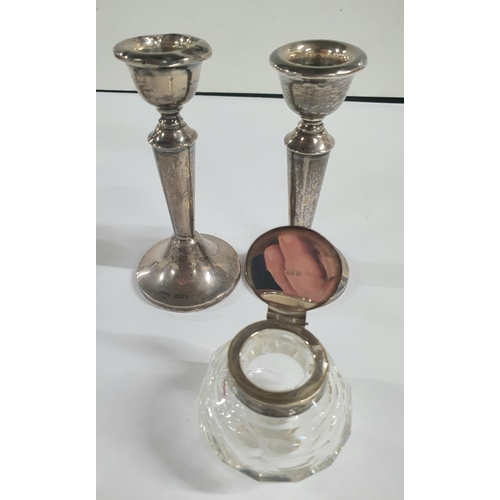 12 - Pair of Birmingham 1938 weighted silver candlesticks, a silver lidded ink well, a pair of silver rim... 