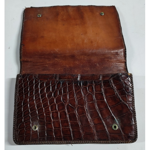 151 - A Crocodile skin, leather lined handbag