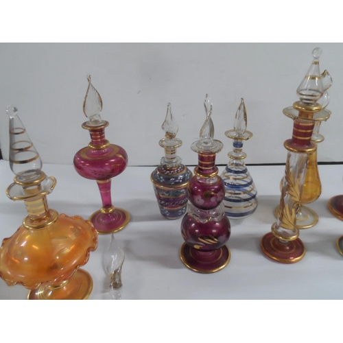 83 - Large quanity of coloured glass perfume bottles (Qty)