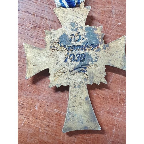 186A - 1938 Nazi party gold mothers enamelled cross together with SS insignia etc (4)