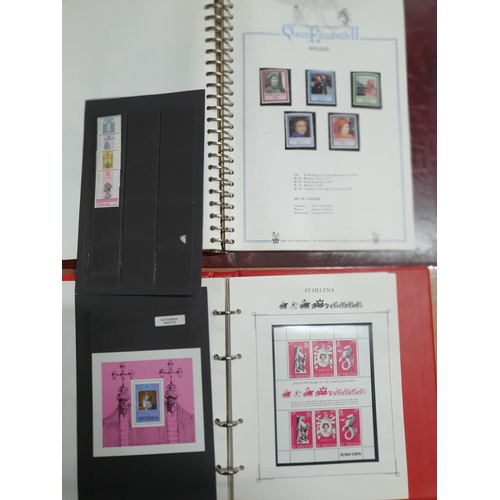 63A - Two albums relating to world stamp sets commemorating the reign of QE II (2)