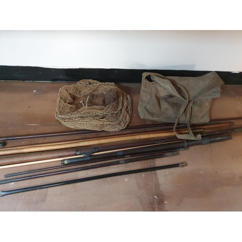 271 - Collection of old fishing rods, mid 20thC together with net and bag and contents (Qty)