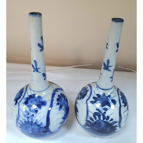 300 - A pair of Chinese blue and white bottle vases with floral decoration (2),

20 cm tall