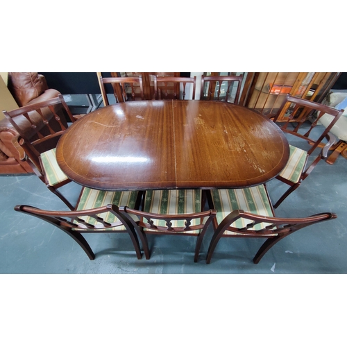 652 - Oval, twin-pedestal dining table, two carvers and six matching dining chairs (9)