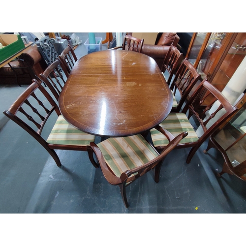 652 - Oval, twin-pedestal dining table, two carvers and six matching dining chairs (9)