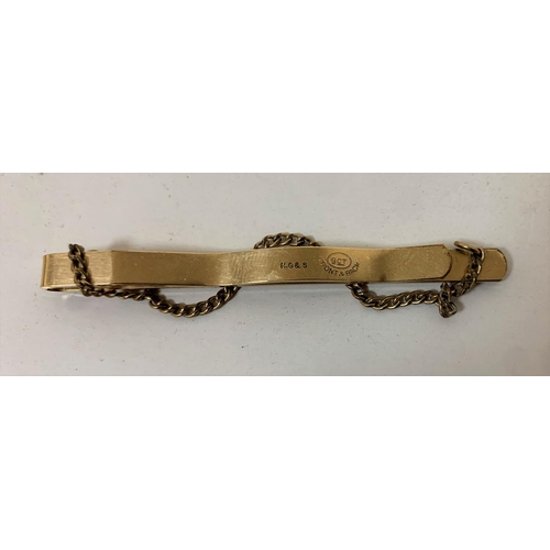 212 - Babies 9ct gold name bracelet (1 gram) together with a 9ct gold B&F tie clip (2)