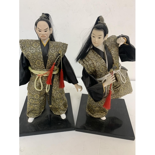 265 - Two Japanese dolls on stands (2)