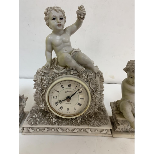 268 - Juliana mantle clock with matching Putti candle-holders