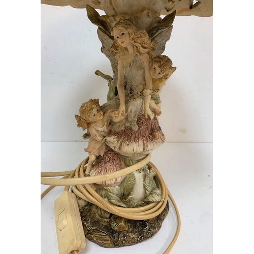 292 - Ornate lamp shade with fairies and mushroom decoration to stem and sunflower decoration to the shade