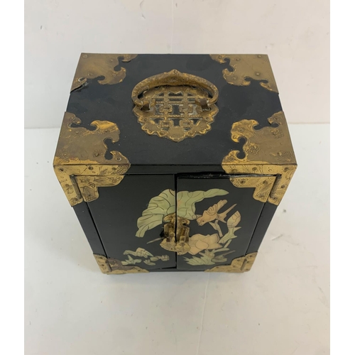 293 - Oriental black lacquered jewellery box with mother of pearl inlay