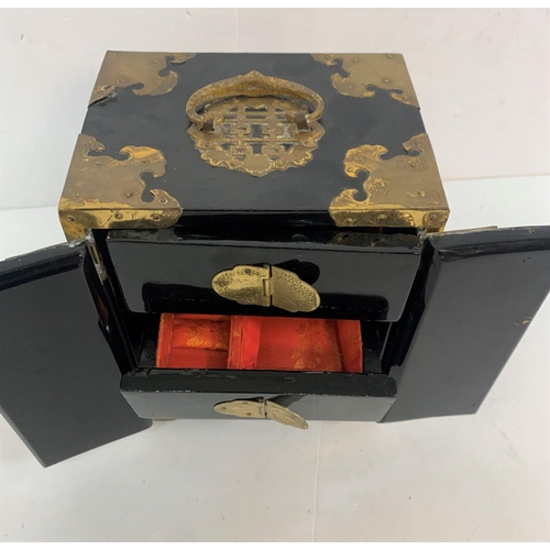 293 - Oriental black lacquered jewellery box with mother of pearl inlay