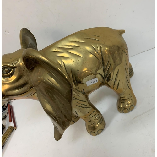 302 - Large brass, free standing Elephant,

42 cm long