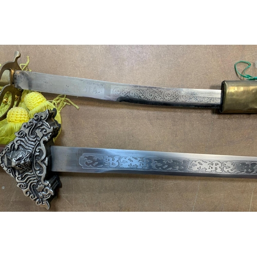 433 - Replica sword together with an brass handled Indian sword (2)