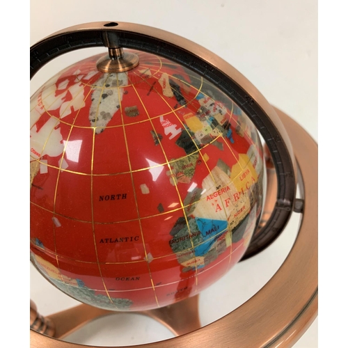 436 - Red stone globe with compass