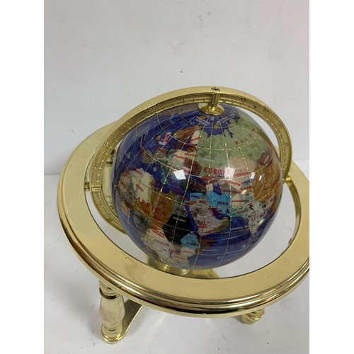 437 - Blue stone globe in brass setting with compass to base