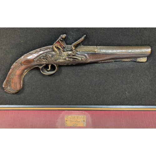 479 - Reproduction pistol, framed as a wall display