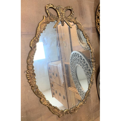 388 - Three small ornate mirrors (3)