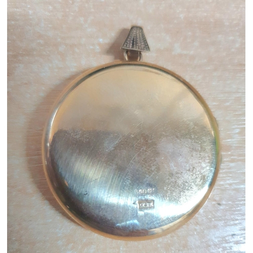 9 - Large 9ct yellow gold circular locket with extensive engraving to front,

10 grams