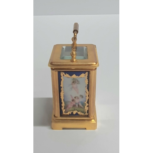 45 - Vintage French miniature carriage clock with porcelain panels and bevelled glass complete with trave... 