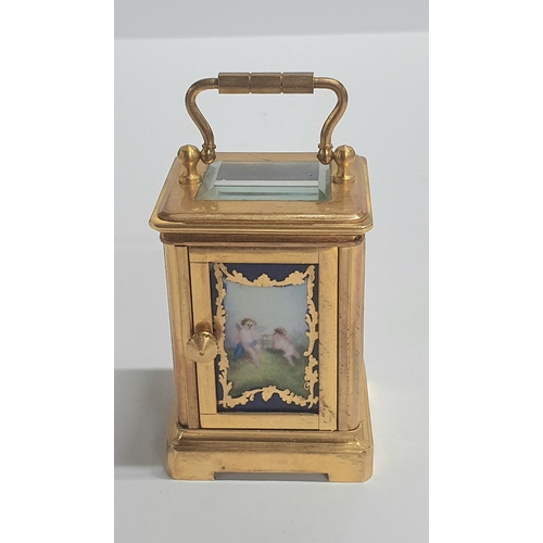 45 - Vintage French miniature carriage clock with porcelain panels and bevelled glass complete with trave... 