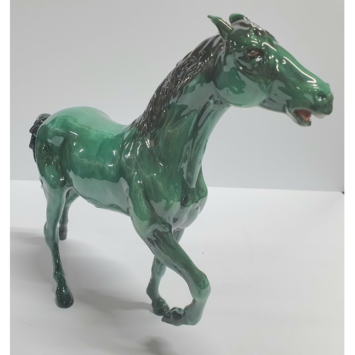 92 - Beswick horse with rare green colouring,

approx 26cm long by 21cm tall