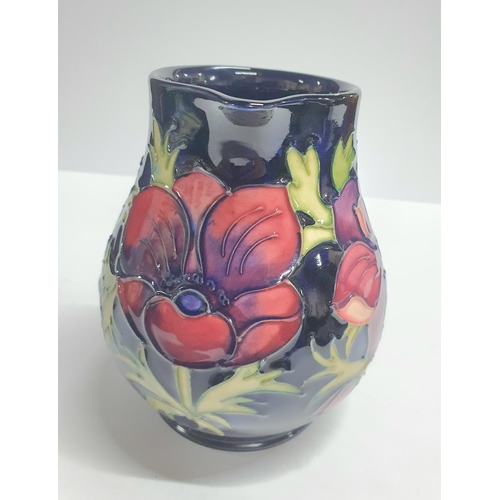 108 - Moorcroft Anemone blue, large cream jug complete with original box,

15cm tall