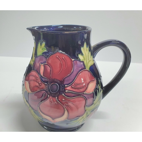 108 - Moorcroft Anemone blue, large cream jug complete with original box,

15cm tall