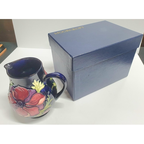 108 - Moorcroft Anemone blue, large cream jug complete with original box,

15cm tall