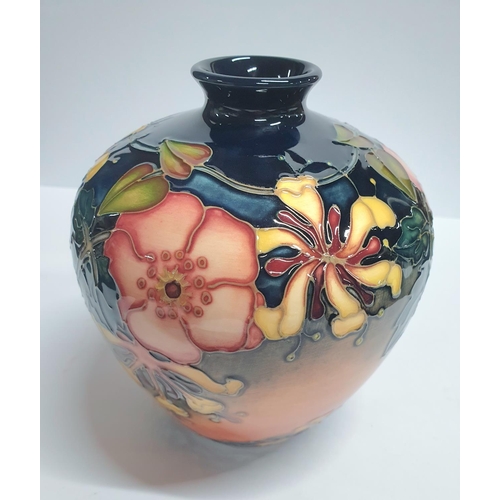 109 - Moorcroft bulbus vase c1990s with original box,

18cm tall